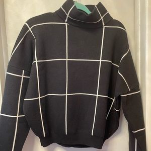 Black turtle neck sweater
